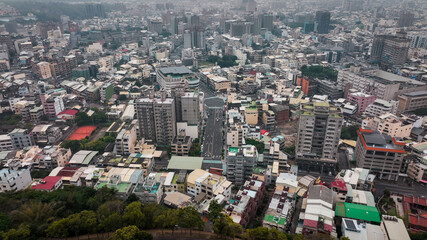Fototapeta premium Aerial view of bustling urban landscape in Changhua Taiwan with diverse buildings and city life