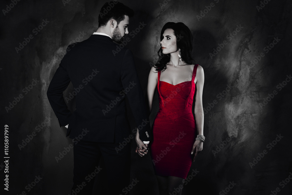 Poster rear view portrait of brunet mr in tux and pretty mrs with front view in purple tight dress with hai
