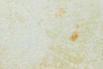 A sheet of old cardboard texture with scratches and stains as background