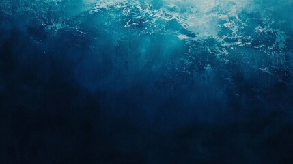 Obraz premium Sunlight filters through the ocean surface, creating a mesmerizing deep blue water background with a gradient of light and shadow, perfect for evoking a sense of tranquility and depth