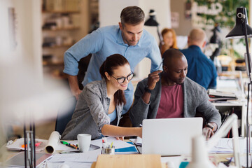 Coworkers working on a project in a startup company office