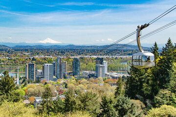 Tram Going to OHSU and City Skyline and Mt. Hood in Portland, Oregon © Brandon Olafsson