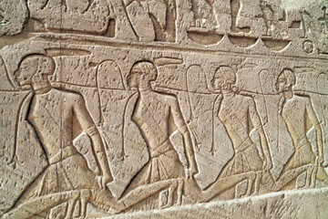 Carvings of kneeling captives roped together on the walls of the Great Temple of Ramses II, Abu Simbel Egypt