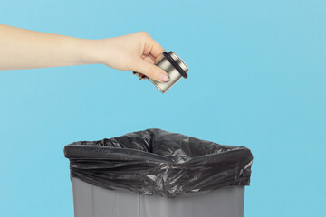 throw old door stop into the trash bin, hold the door stop in your hand in front of the trash can