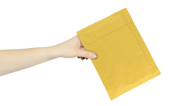 Cardboard package for document delivery, soft envelope, cardboard package, packaging paper letter in hand, outstretched hand with packaging paper letter isolated from background