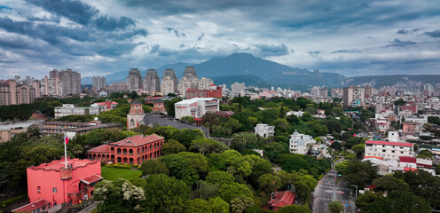 Exploring Fort Santo Domingo in Taiwan surrounded by lush greenery and urban landscape
