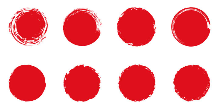 Set of red grunge circles. Stamp with jagged edges. Japanese sun isolated on white background.