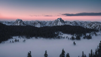 aerial view of a snow-capped mountain range at sunrise