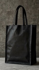 Elegant black shopping bag with sturdy handles.