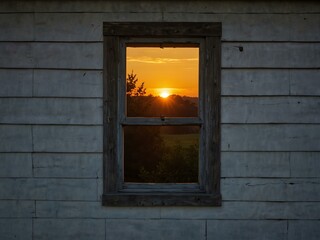 Enchanting sunrise through wooden-framed window.