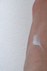 Fototapeta premium Caucasian skin person white cream beauty product close up concept