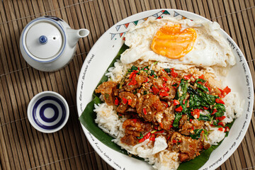 A plate of Thai stir-fried pork with holy basil.