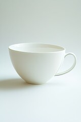 Elegant white ceramic tea cup showcased in a minimalistic style, highlighting simplicity and elegance for home and dining purposes.