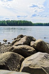  Granite boulders on the river bank in Karelia.                              