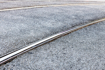 steel rails of tram tracks on city street