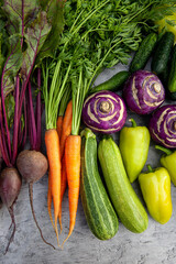 Fresh vegetables - carrots, beets, zucchini, peppers, cucumbers and kohlrabi cabbage - for health and cooking, wellness and nutrition with vegan or vegetarian meal prep. Vegetables, organic produce