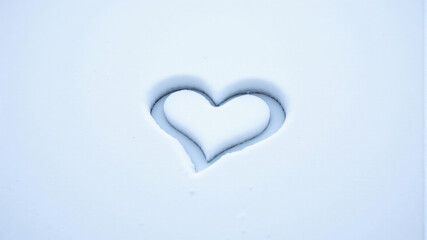 Symbol of Love: Heart Imprint in Snow