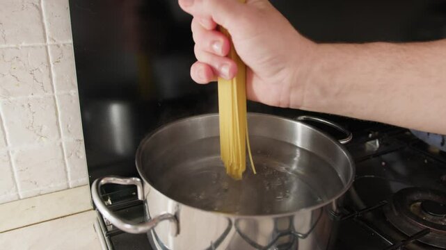 Throw Spaghetti Gluten Free Pasta Into A Pot Of Boiling Water