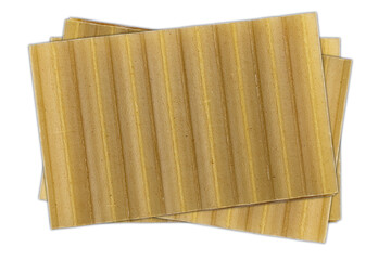 Lasagna pasta sheets stacked on a white background, showcasing their uniform texture