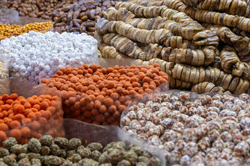 Mixed dried goods and treats in Moroccan market stall