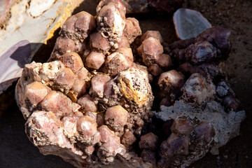 Close-up of crystalline stone with prismatic structures in earthy colors