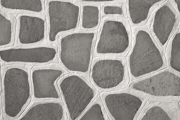 Background of stone floor texture. Traditional cobblestone white painted pattern pavement