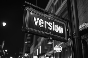 Obraz premium A black and white nighttime street scene featuring a glowing neon sign that says 