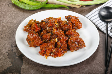 Manchurian chicken with sauce and spices