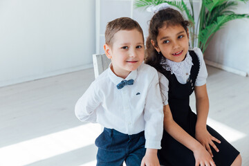 Boy and girl schoolchildren sitting in a training lesson