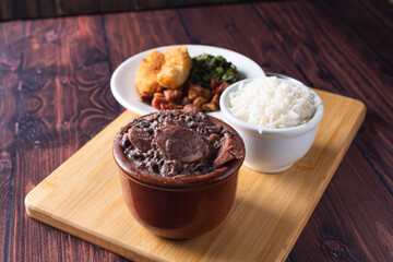 Bowl with feijoada and spices Typical Brazilian food