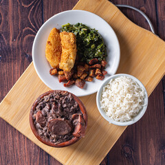 Bowl with feijoada and spices Typical Brazilian food