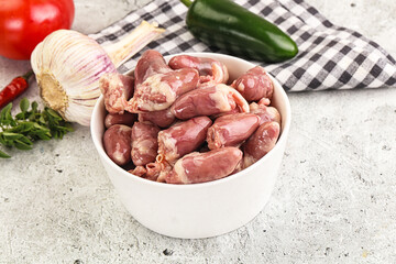 Fresh raw chicken hearts in the bowl