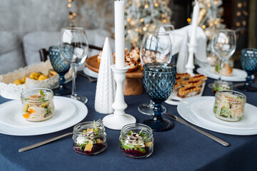 A beautifully arranged table set up for an elegant dinner party, complete with decorative plates,...