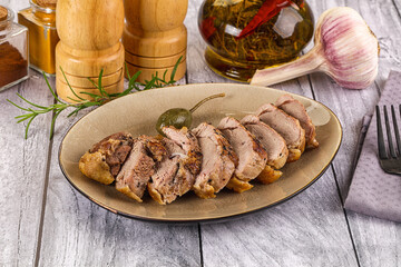Roasted duck breast slices in the plate