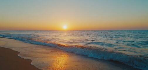 Fototapeta premium Serene Sunset Over Tranquil Ocean Waves Illuminating Sandy Shoreline with Warm Hues of Orange, Pink, and Blue Creating a Calming Atmosphere for Relaxation and Reflection