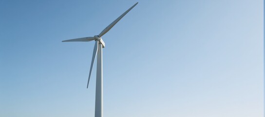 Fototapeta premium Modern wind turbine towering over clear skies representing clean energy and environmental conservation