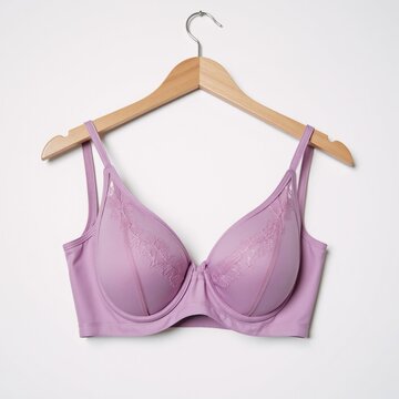 Pink and purple lace bra displayed on a hanger use for various designs wrapping paper booklets etc