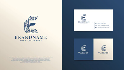 Fototapeta premium Elegant Letter E Logotype, with intricate floral patterns and a minimalist leaf, symbolizing elegance, growth, and sustainability