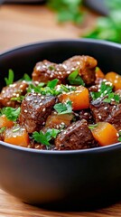 Fototapeta premium Delicious beef stew with vegetables served in a black bowl at a cozy kitchen setting