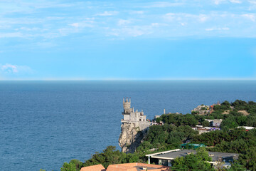 Journey to Crimea. The attraction of the city of Yalta is the Swallow's Nest Palace against the background of the Black Sea. Selective focus,