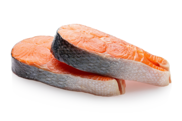 Two fresh raw salmon steaks lying on each other isolated on white background, sharpness across the entire object