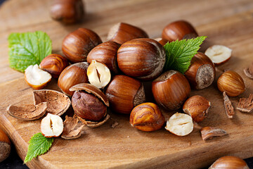 Hazelnuts pile on a wooden board