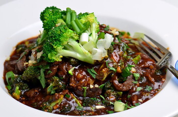 A food shot of a healthy dish made from Brocoli and rice isolated on a white background.
