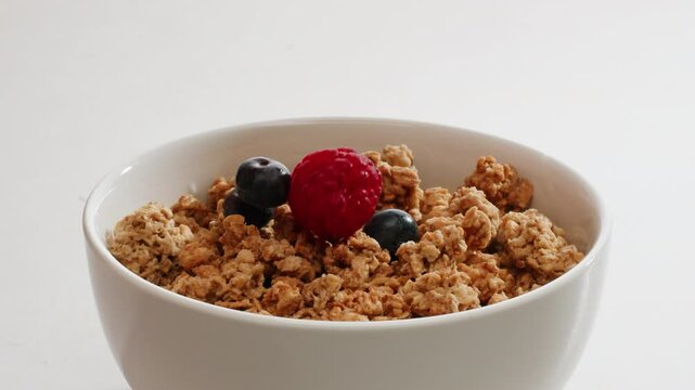 Whole grain cereals with fresh milk for breakfast, healthy breakfast with blueberry berries and yougurth kefir. Cooking morning breakfast.