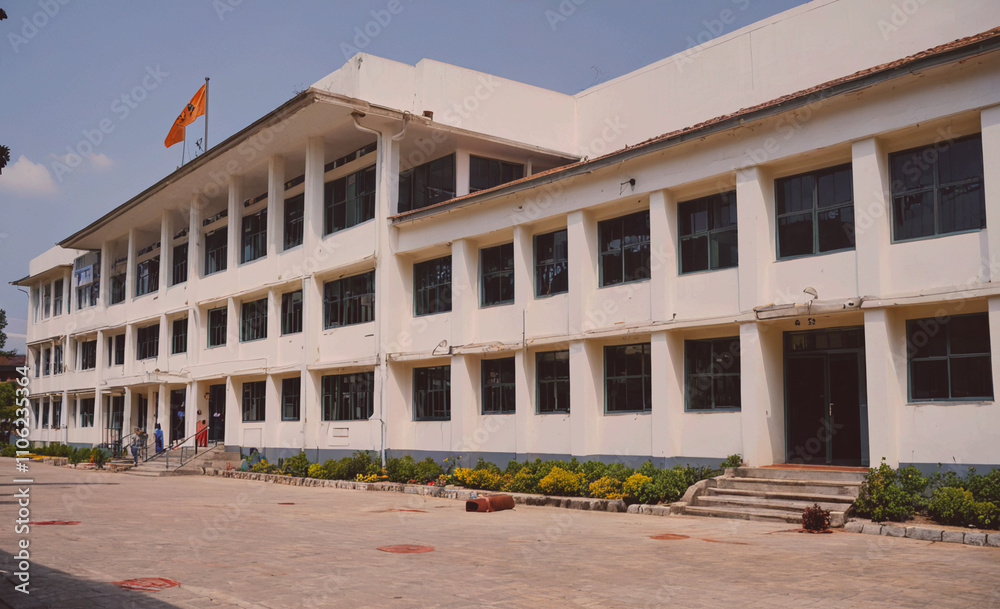 Aufkleber large white building with a flag on the roof. the building has many windows and a large front door