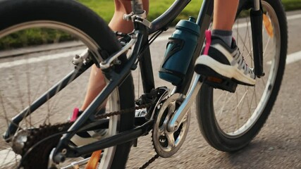 Man kid child ride bicycle near beach in Barcelona, city morning, carbon neutral transportation. Travel, sustainability and cycling with male speed and transit, professional rider training, cardio