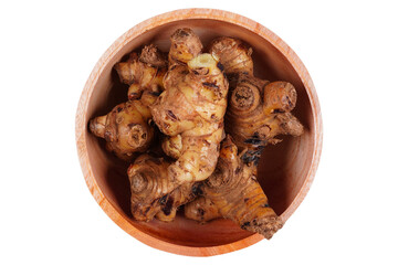 Galangal root on a wooden bowl isolated transparent