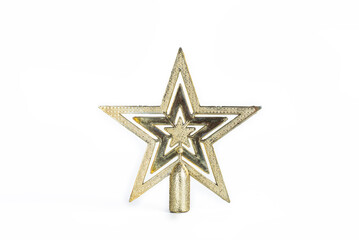 Obraz premium Shimmering gold star for festive Christmas tree decoration on white background, Close Up