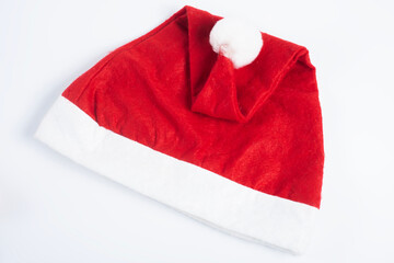 Festive red Santa hat with white fur trim on a white background, Top view
