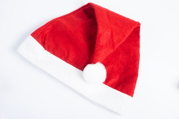 Festive red Santa hat with white trim on a white background, Top view